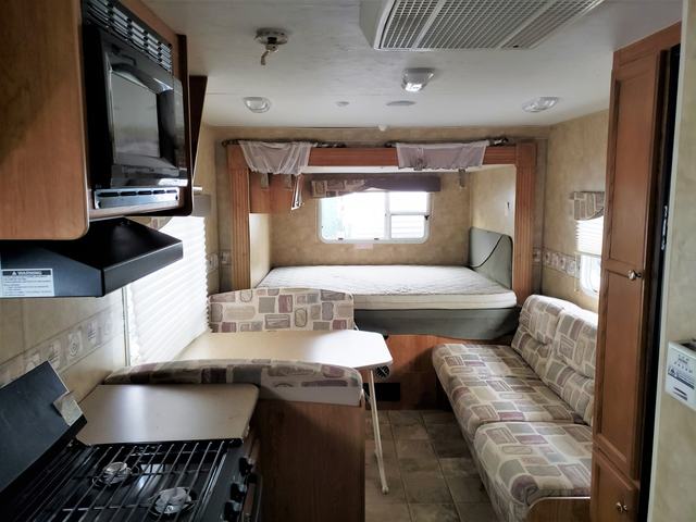 Jay Feather kitchen, sofa and rear queen bed